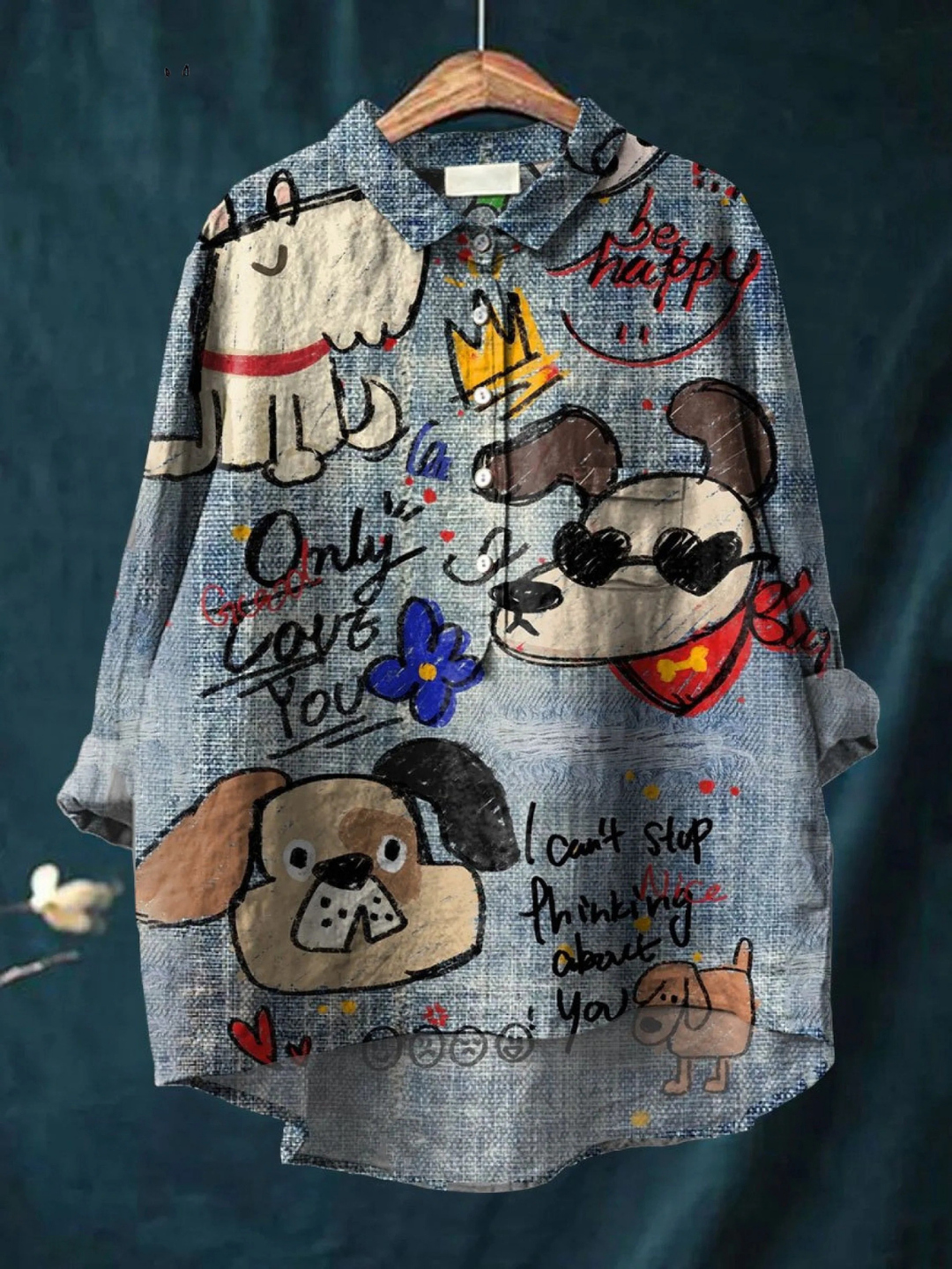 Denim shirt with cartoon dog designs and text on a dark blue background