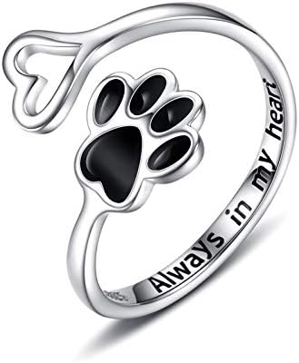 Silver ring with paw print design and &
