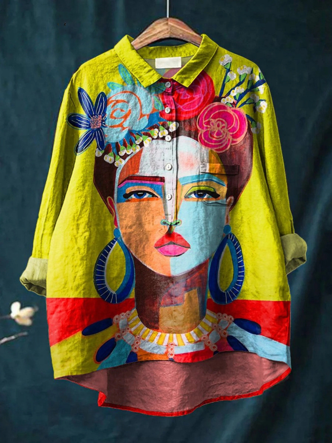 Colorful shirt with artistic face design on a dark background