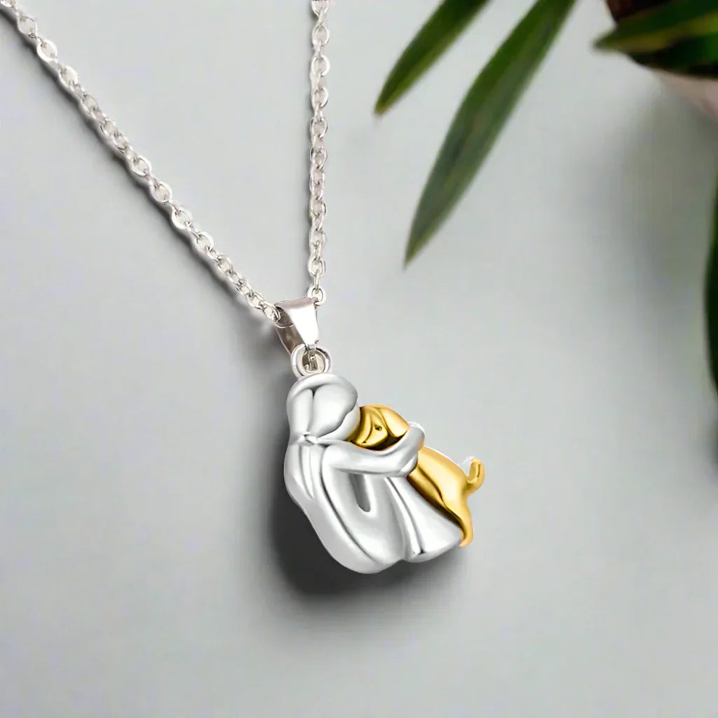 Two-toned pendant necklace on a light gray background