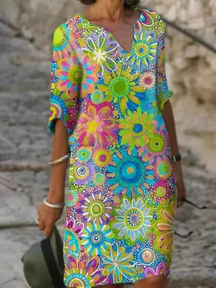 Colorful floral dress with a pattern of flowers on a blurred background