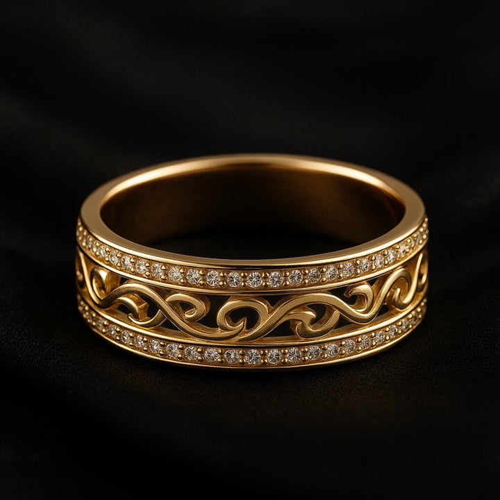 Gold ring with intricate design and small diamonds on a black background