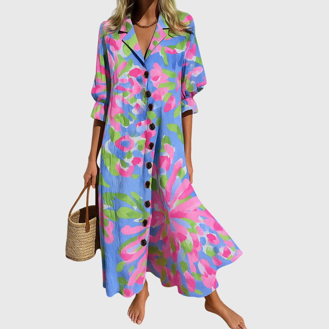 Woman wearing a colorful floral dress on a white background