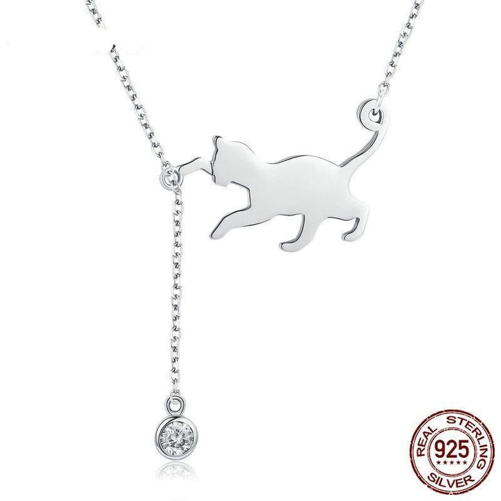 Silver cat-shaped pendant necklace with a small round gemstone on a white background, featuring &